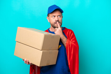 Super Hero delivery man isolated on blue background having doubts while looking up