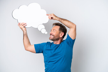 Middle age caucasian man isolated on white background holding a thinking speech bubble