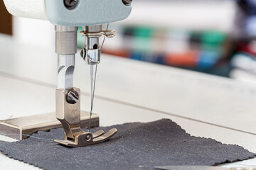Sewing machine needle with thread and fabric