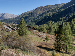 The road  to Navache in autumn village, along Claree valley, near Briancon, Hautes-Alpes...