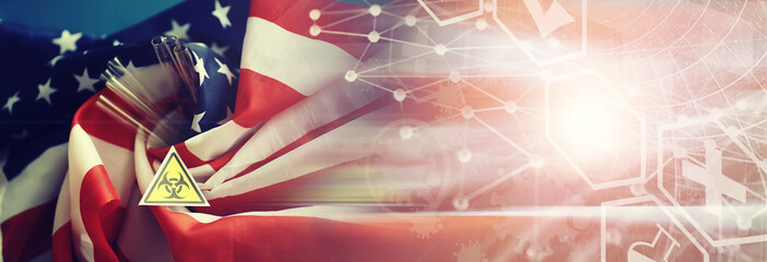 American flag, test tubes and biohazard sign. The concept of American biolabs and research centers.