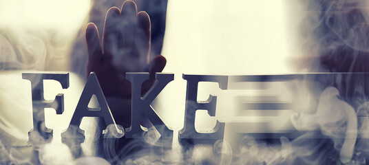 The concept of modern information technology. Fake and facts in the news. The letters spelled the...