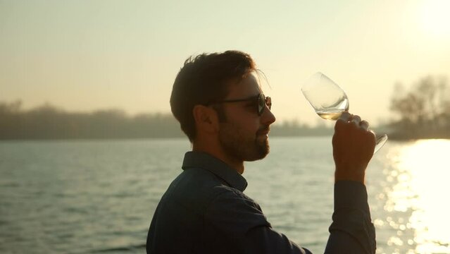 winegrower drink white wine. winemaker testing wine in glassg 