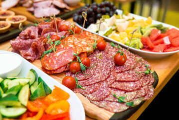 range of sausage cuts (chorizo, salami) on the snack table