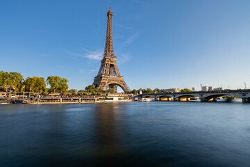 Fototapeta na wymiar Eiffel Tower by Seine river in Paris