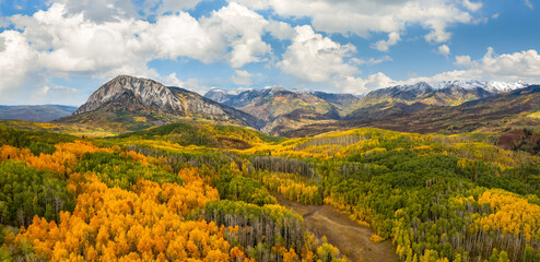 Autumn colors in the Colorado Rocky Mountains on scenic Gunnison County Road 12 through the Kebler Pass - view towards Marcellina Mountain - obrazy, fototapety, plakaty