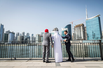 Multi-ethnic business team meeting outdoors - International and multicultural people on a business...