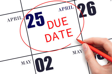 Hand writing text DUE DATE on calendar date April 25 and circling it. Payment due date