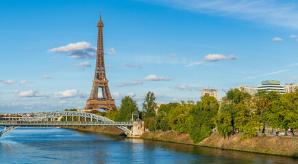 Fototapeta na wymiar Eiffel Tower by seine river in autumn season in Paris. France