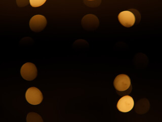 Golden and dark brown round bokeh lights festive background