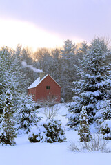 Tranquil New England winter scene following a departing snowstorm. Clearing sky, warm cozy home...