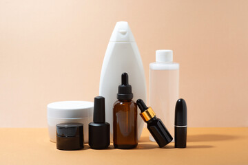 Set of body care products on a beige background, close-up