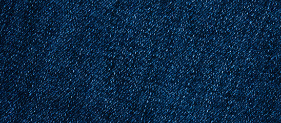 Stylish denim background in banner format. Blue jeans close-up