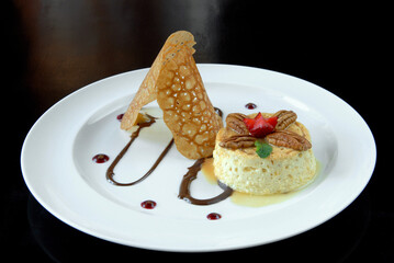 Neapolitan flan, flan dessert with walnuts, strawberry and chocolate, slice of pudding dessert