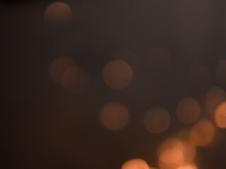 Golden and dark brown round bokeh lights festive background