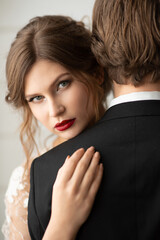 Woman bride in a wedding dress with a beautiful hairstyle, portrait