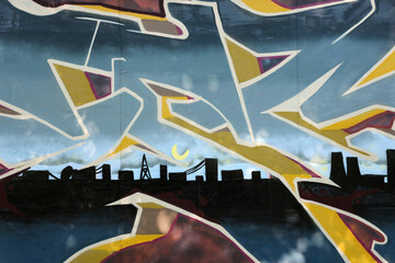 Colorful background of graffiti painting artwork with bright aerosol strips on metal wall. Old school street art piece made with aerosol spray paint cans. Contemporary youth culture backdrop