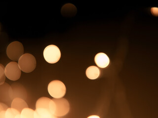 Golden and dark brown round bokeh lights festive background