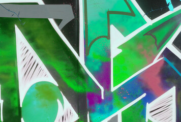 Colorful background of graffiti painting artwork with bright aerosol strips on metal wall. Old...