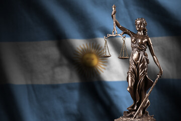 Argentina flag with statue of lady justice and judicial scales in dark room. Concept of judgement...