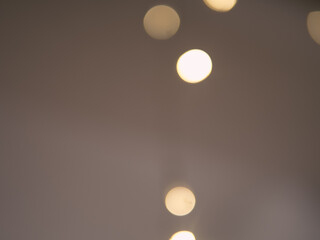 Golden and dark brown round bokeh lights festive background