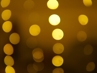 Golden and dark brown round bokeh lights festive background