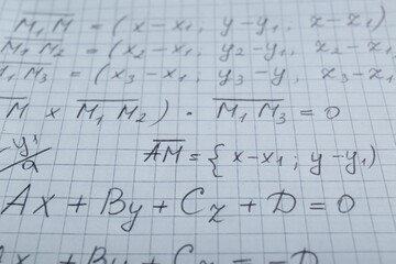 Sheet of paper with different mathematical formulas, closeup
