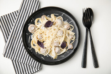 Delicious pasta with mushrooms served on white table, flat lay