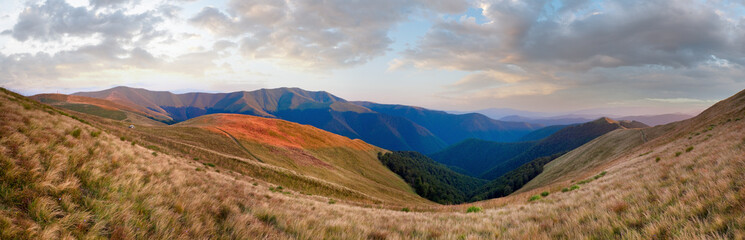 Fototapeta na wymiar Summer morning mountain landscape with two tourist tent on slope (Ukraine, Carpathian Mountains).