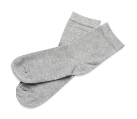Pair of light grey socks isolated on white, top view