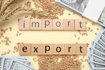 Words Import and Export made of wooden squares, ears of wheat and banknotes on beige background, flat lay