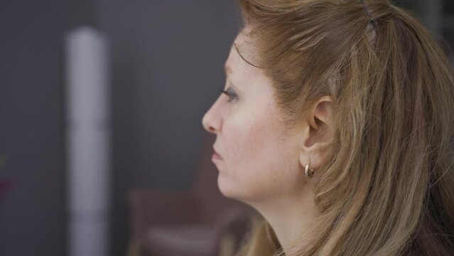 Sad depressed mature old woman thinking alone at home, depressed.
Worried mature woman at home is depressed, overwhelmed by anxiety and loneliness.
