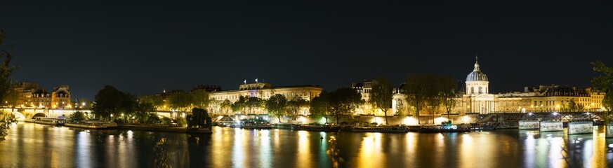 Paris evening riverside panorama overlooking Pont des Arts and Pont Neuf bridges