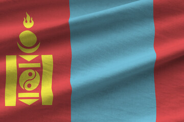 Mongolia flag with big folds waving close up under the studio light indoors. The official symbols...