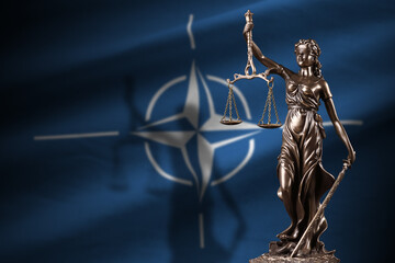 Abkhazia flag with statue of lady justice and judicial scales in dark room. Concept of judgement...