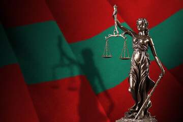 Transnistria flag with statue of lady justice and judicial scales in dark room. Concept of...
