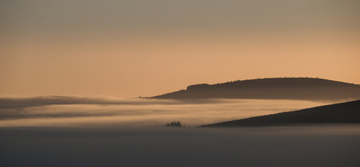 Sunrise inversion with hills showing.