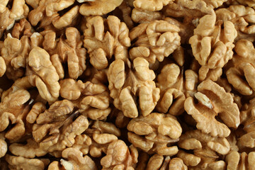 Top view of a pile of big shelled walnuts