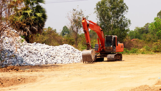 Road construction. Road works and road equipment. Excavator operation