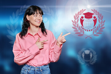 Teenage girl pointing with her hand at symbol of university