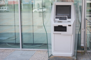 Close-up of a ticket vending machine with a blank black screen