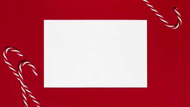 White paper ball unwrapping on Christmas red background_Stop Motion Animation