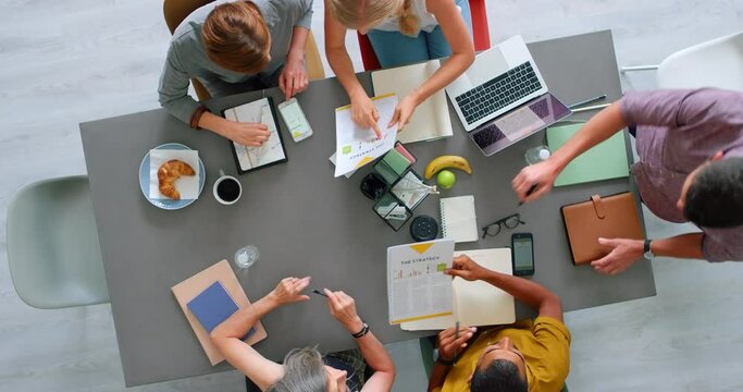 Startup, business people and meeting for digital marketing, website copywriting and brainstorming ideas at office workspace from above. Manager, technology and team collaboration on a design proposal