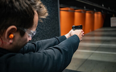 Fototapeta premium person with gun in Detroit