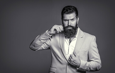 Male in tuxedo. Black and white. Man in suit. Male beard and mustache. Elegant man in business suit. Sexy male, brutal macho, hipster