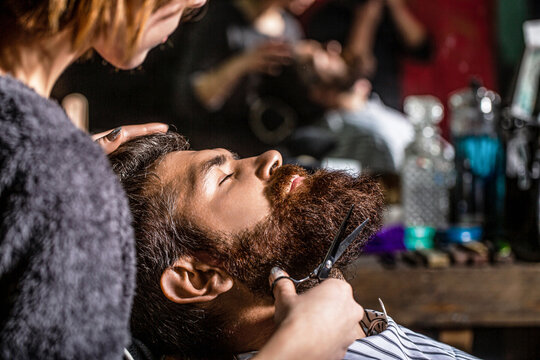 Hairdresser, hair salon. Bearded man. Barber scissors, barber shop. Vintage barbershop, shaving. Man hairstylist. Beard man in barbershop. Hairstylist serving client at barber shop, bearded