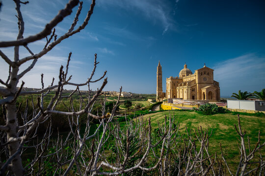 Overv iew of majestic and big Basilica of the National Shrine of the Blessed Virgin of Ta' Pinu on the island of Gozo, Malta on a sunny day.