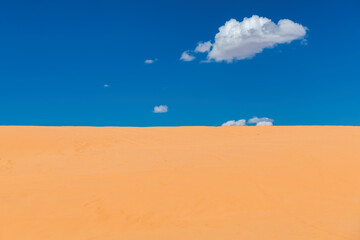 Fototapeta na wymiar Sand desert and bue sky in desert