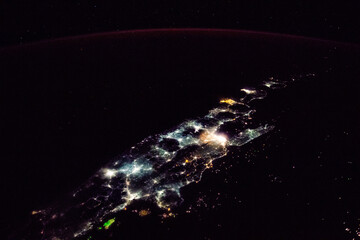 Fototapeta na wymiar Night time sky aerial view of city lights in Java, Indonesia. Digitally enhanced. Elements of this image furnished by NASA.