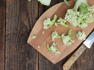 Organic cauliflower on a wooden table close up